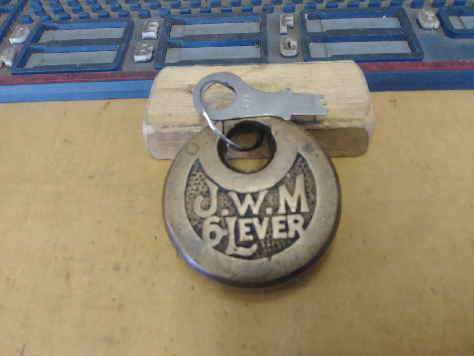 antique/vintage JWM 6 lever push key pancake padlock w/key 69