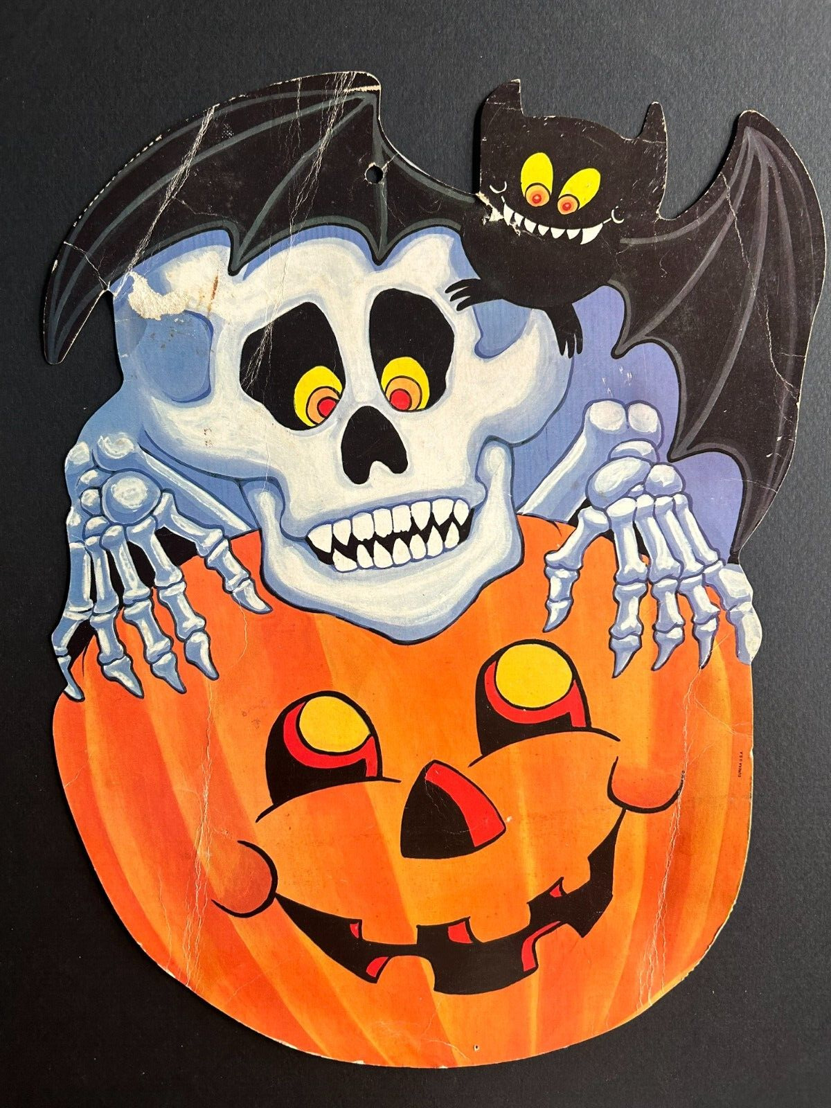 Vintage Halloween Decoration: Skeleton and Bat Peeking Over A Jack-o\'-Lantern