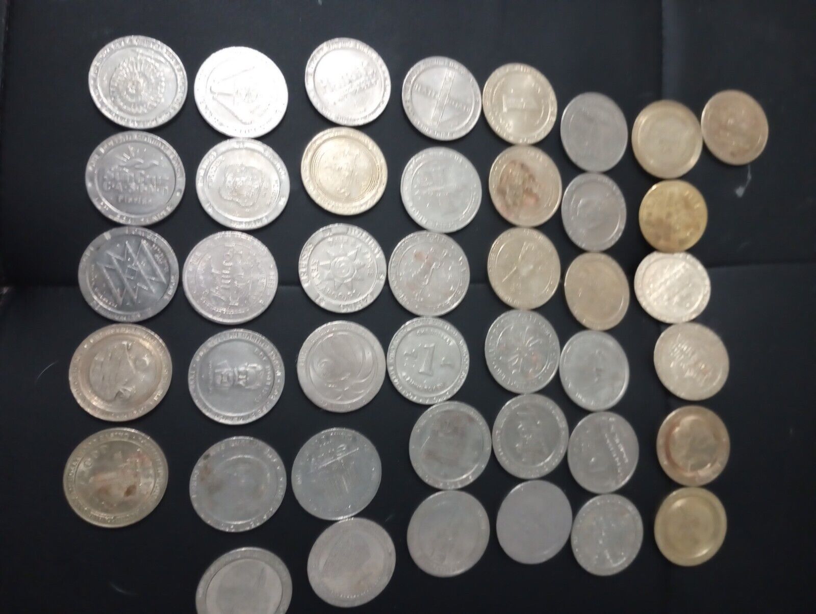 $1.00 casino tokens gold and silver /used /fair condition 