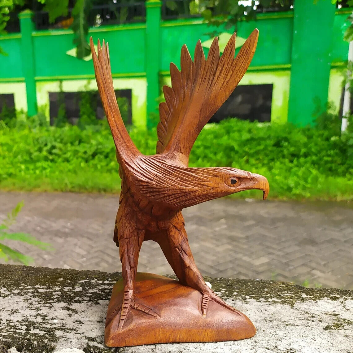 Wooden eagle statue. wooden flying eagle. Eagle statue flapping its wings