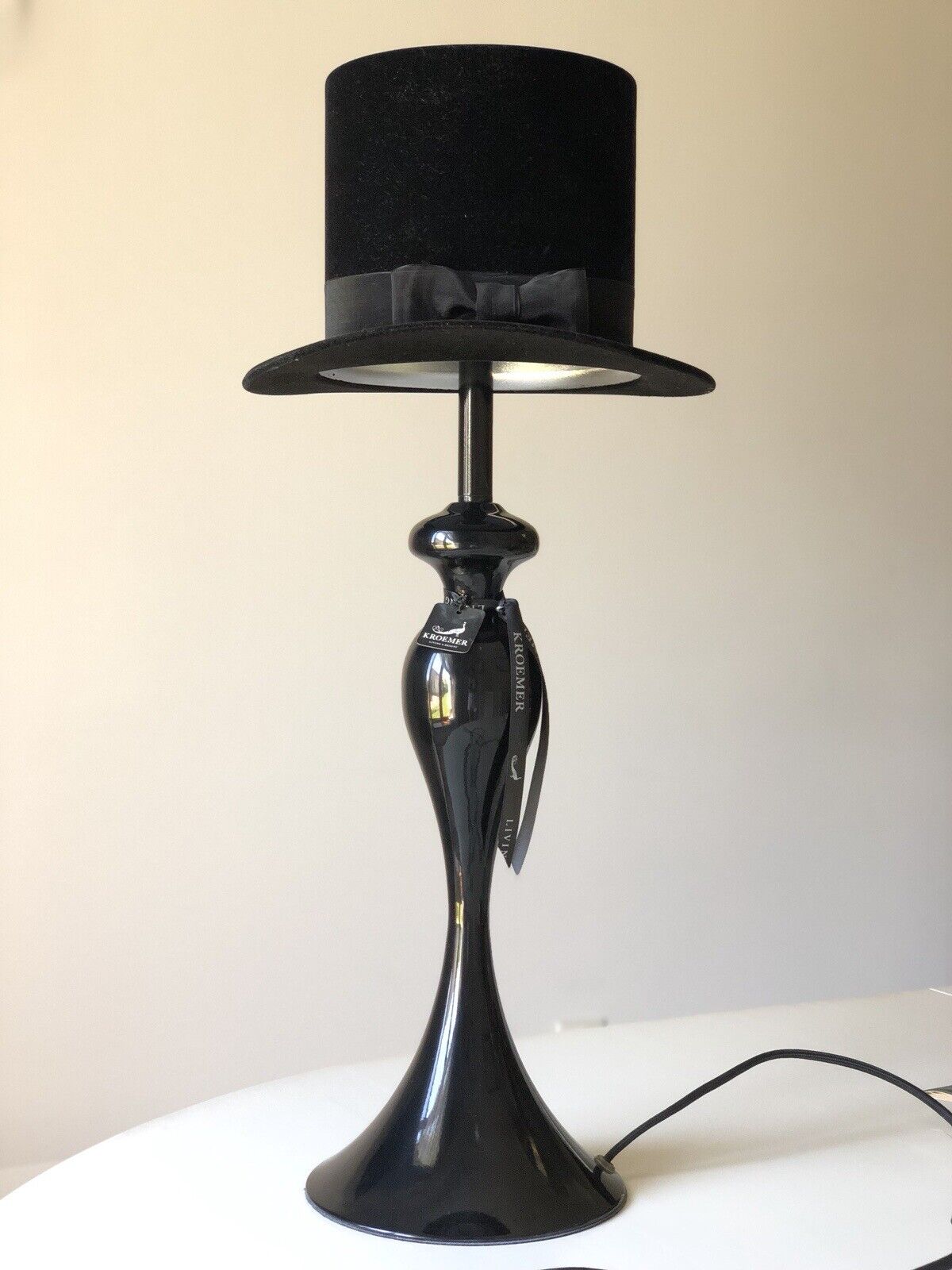 Designer lamp on an elegant leg with a velvet cylinder and bow KROEMER Germany.