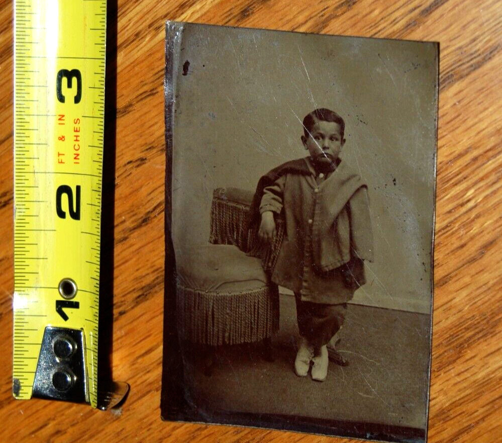 Tintype of a child #41 Little boy with unusual clothes