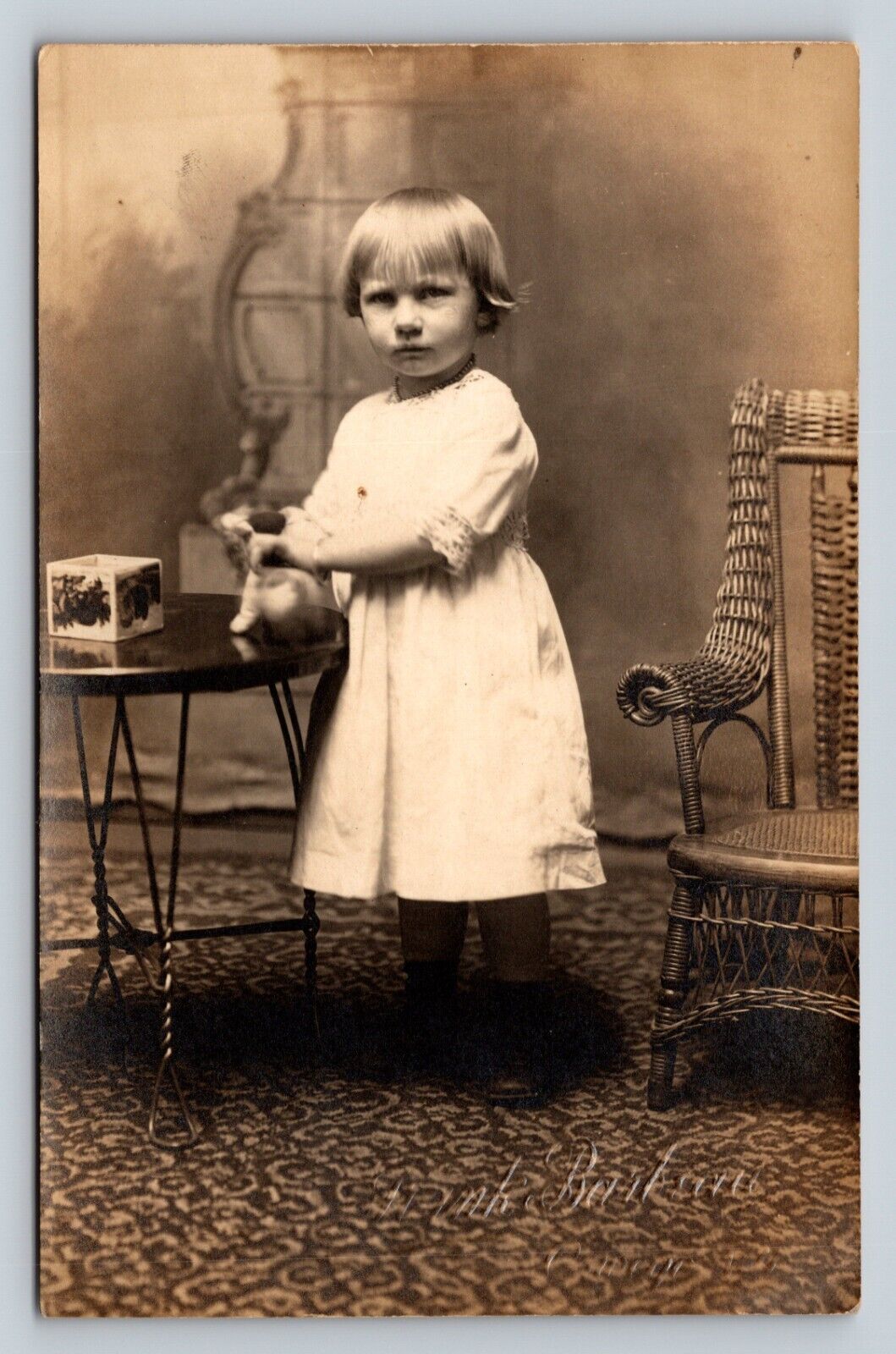 RPPC Little Girl Plays w/ Toy & Glares At Camera ANTIQUE Postcard ARTURA 1910-24