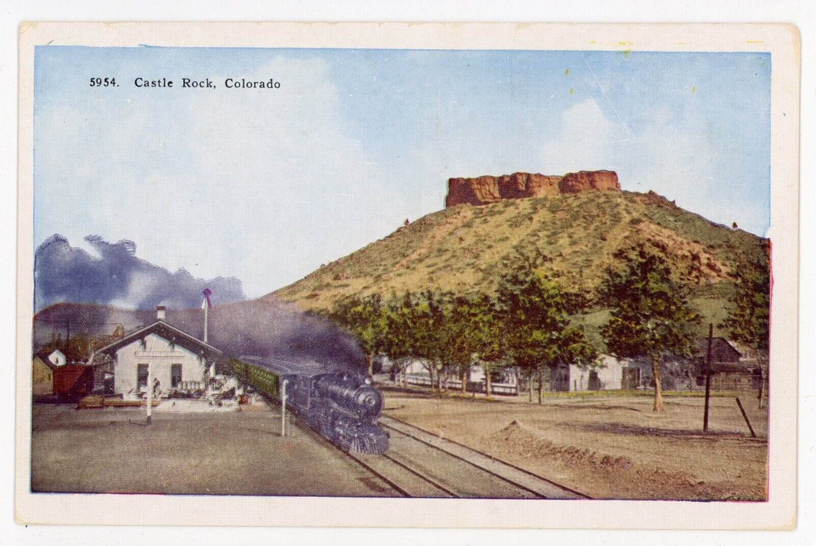 CO, Castle Rock. TRAIN LEAVING THE RAILROAD STATION. Early Postcard