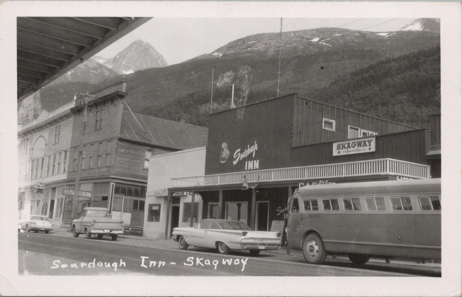 RPPC Postcard Sourdough Inn Skagway Alaska AK Vintage Cars