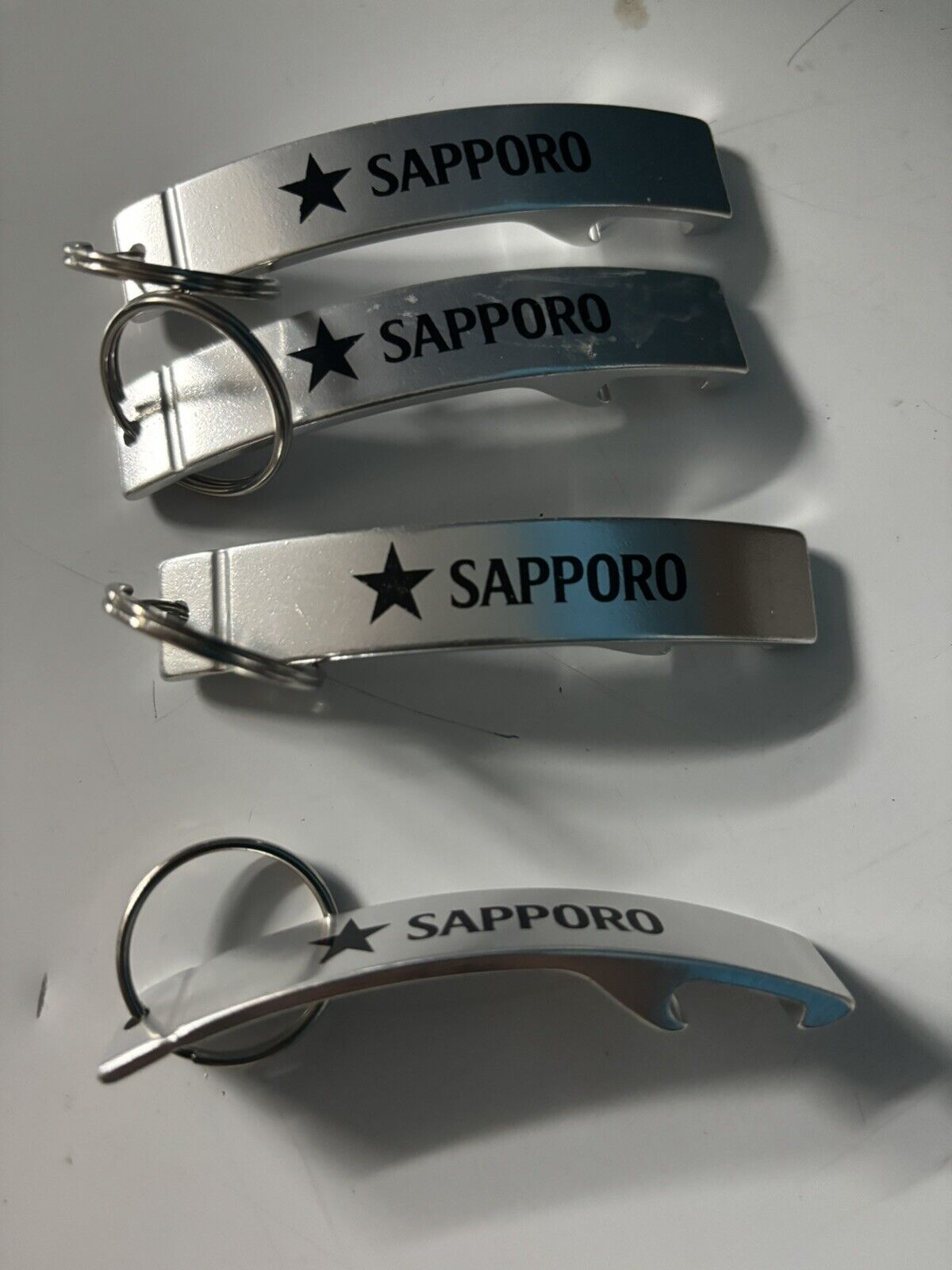 Sapporo Beer Keychain Bottle Openers Lot (x4).  
