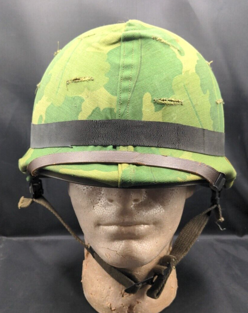 Vietnam War US M-1 helmet with camo cover complete with liner,