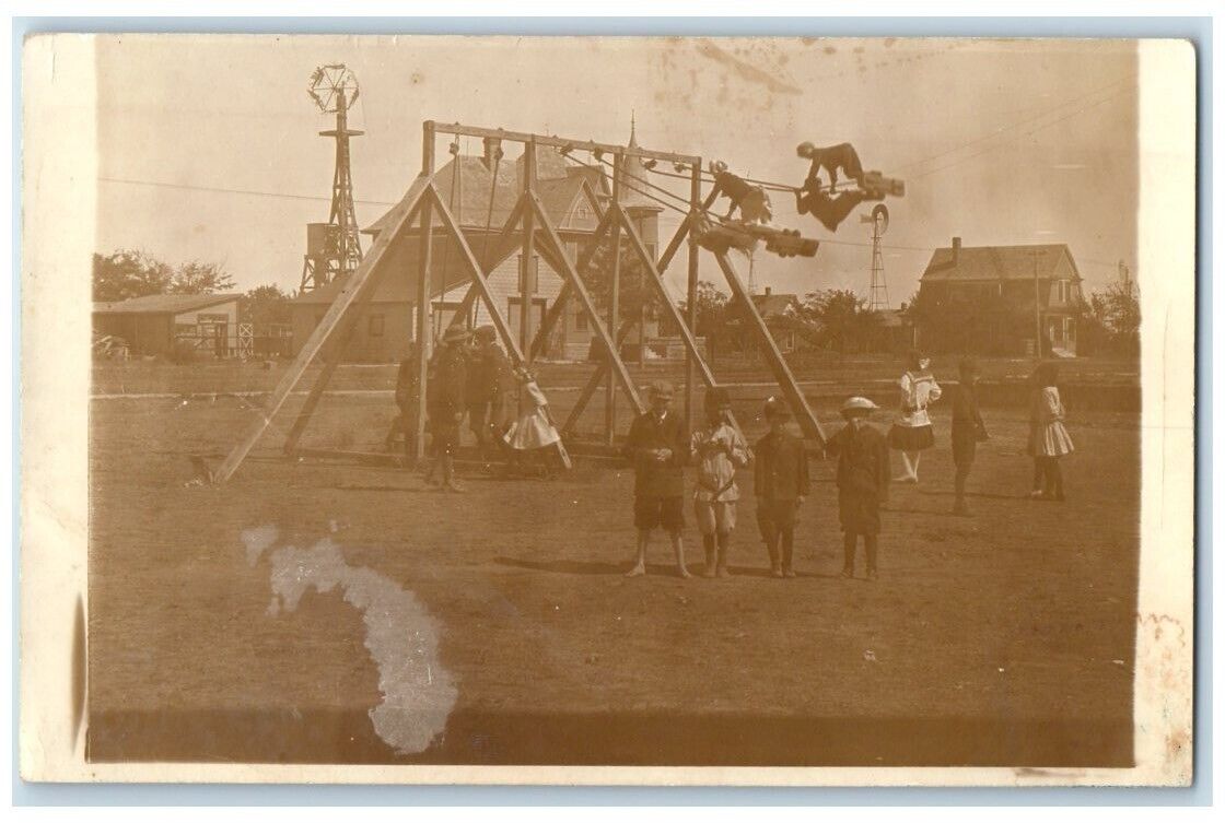 1913 School Playground Swings Children Spearville Kansas KS RPPC Photo Postcard