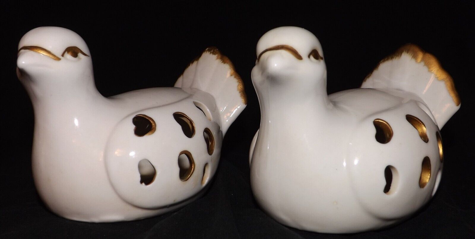 Porcelain dove figurines. Small white with gold accent hearts on the side. 