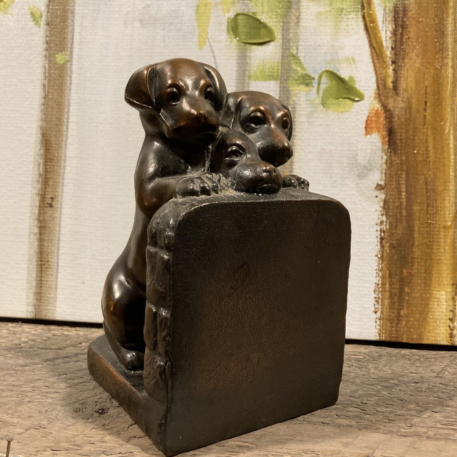 Vintage three puppies peeking over a wall book and cast aluminum and bronze