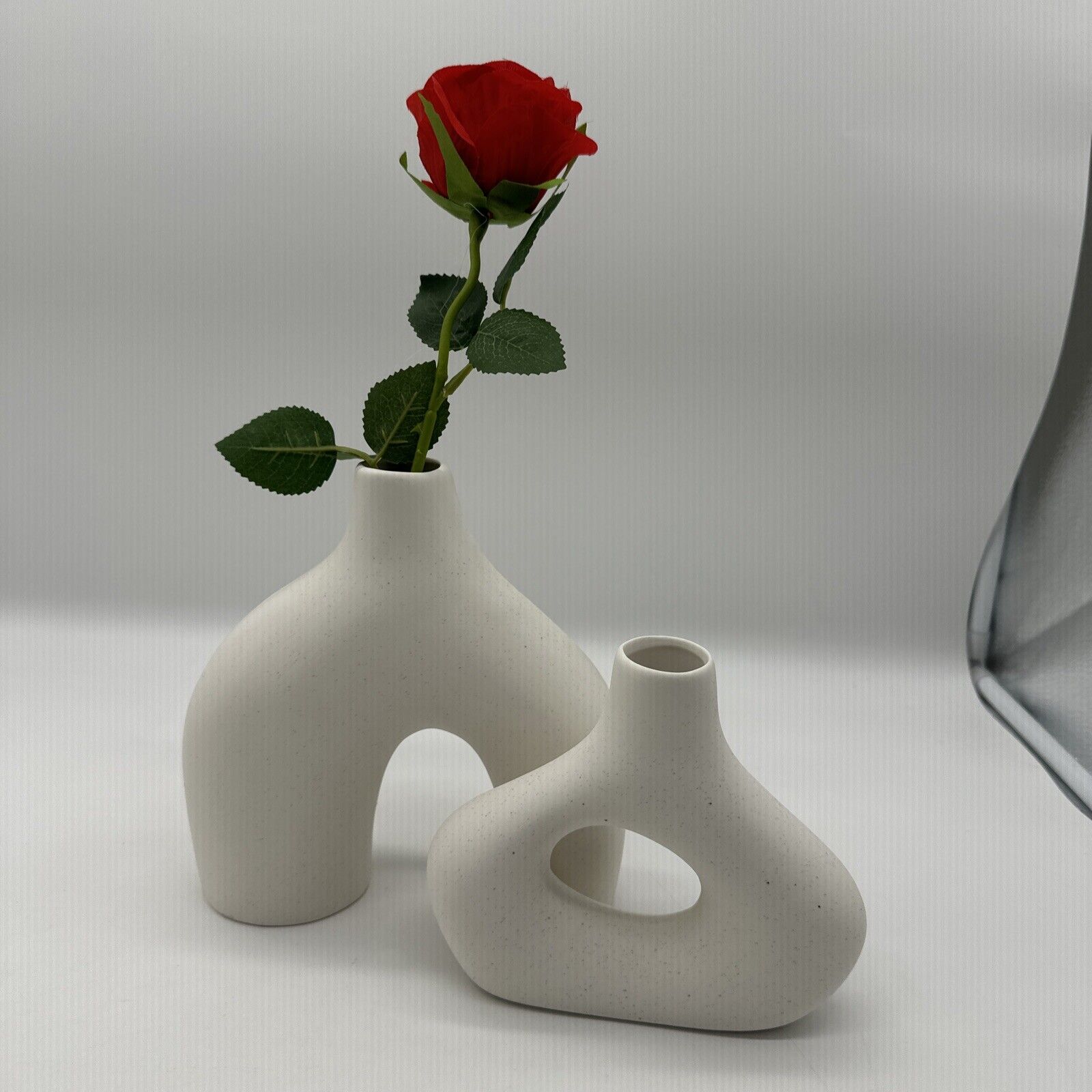 Two beautiful white stone looking vases (T)
