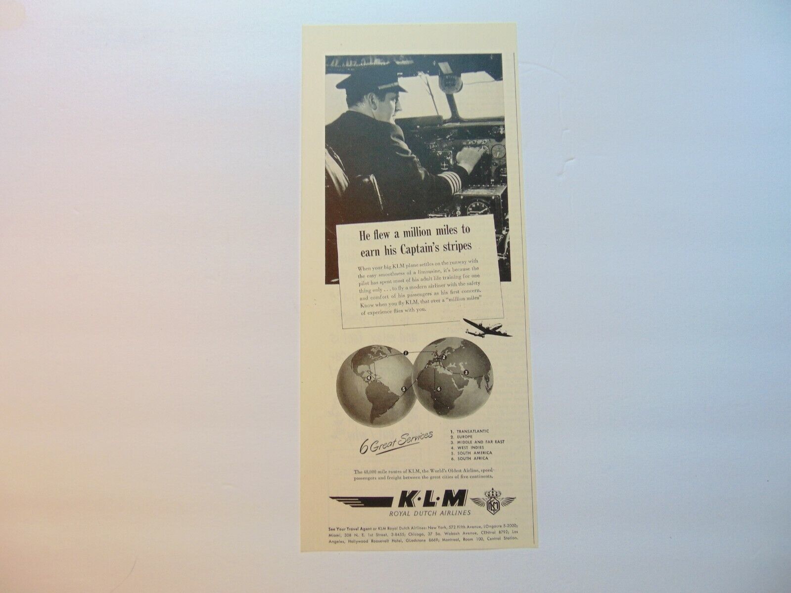 1948 K.L.M. ROYAL DUTCH AIRLINES Globe Captain Flew a Million Miles art print ad