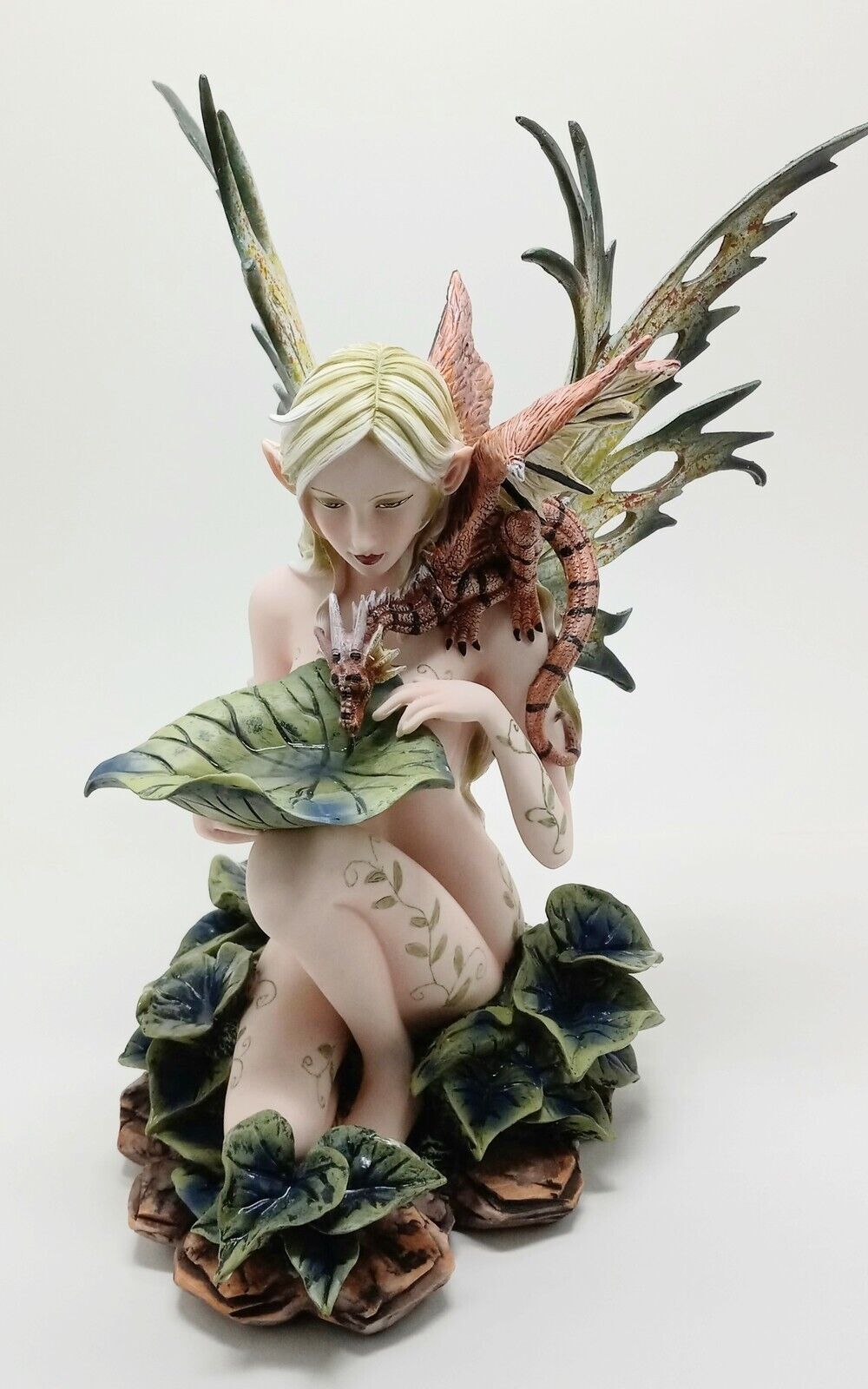 Nude Lake Fairy Sitting with Nature Colored Wings and Drinking Dragon H= 13 In