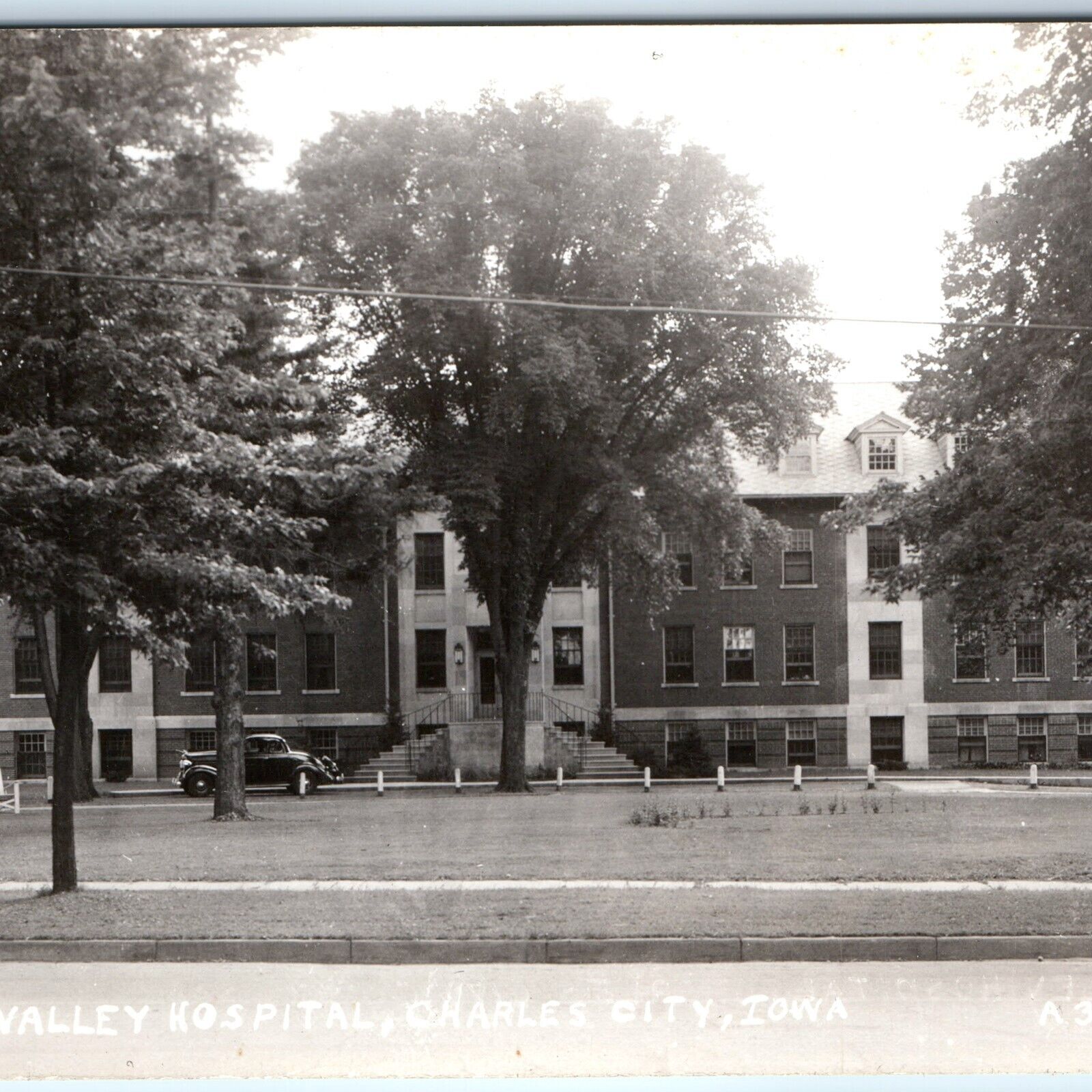 c1940s Charles City, IA RPPC Cedar Valley Hospital Car Wide Real Photo PC A168