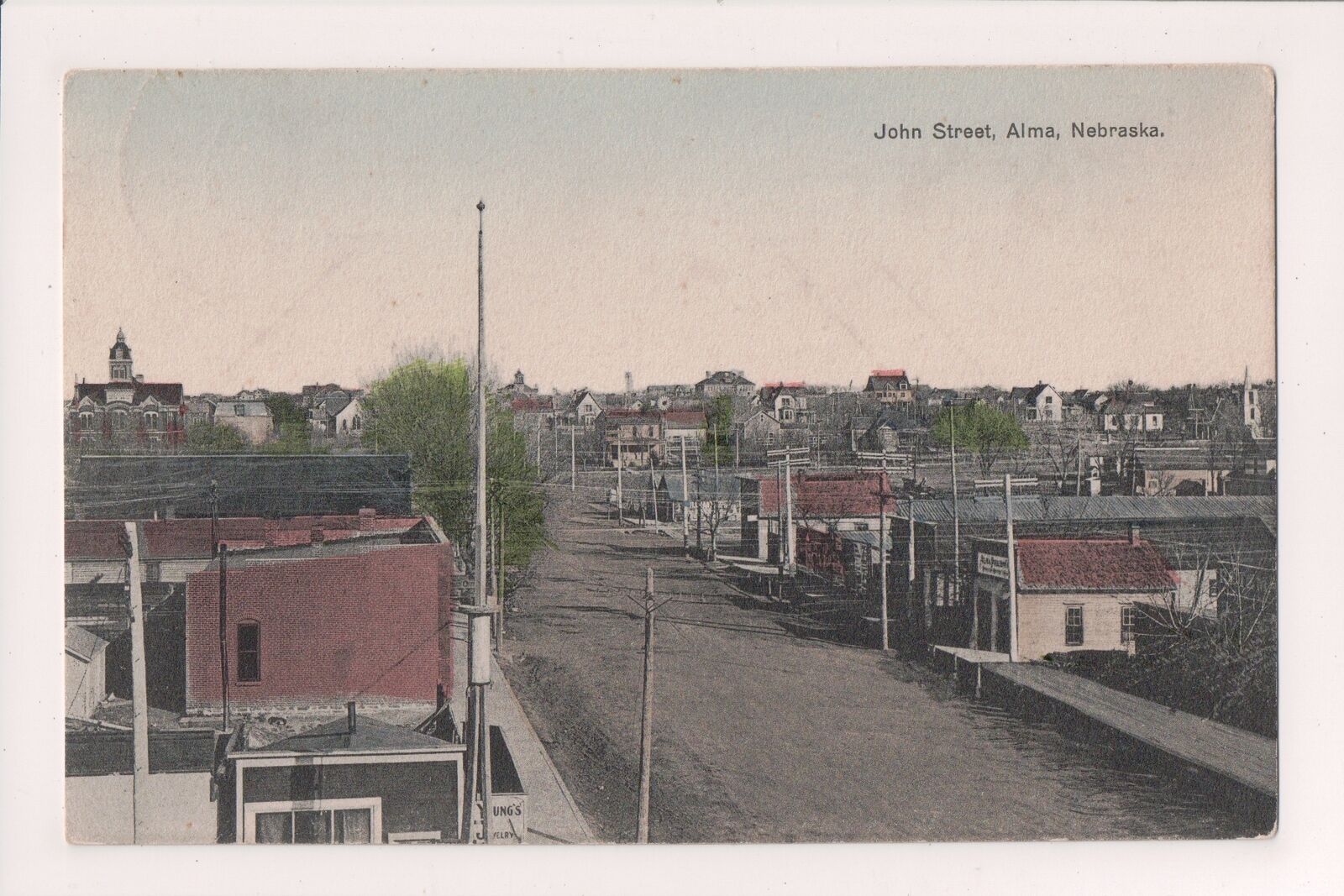 N-488 Alma Nebraska John Street Scene Hand Colored Postcard 1913