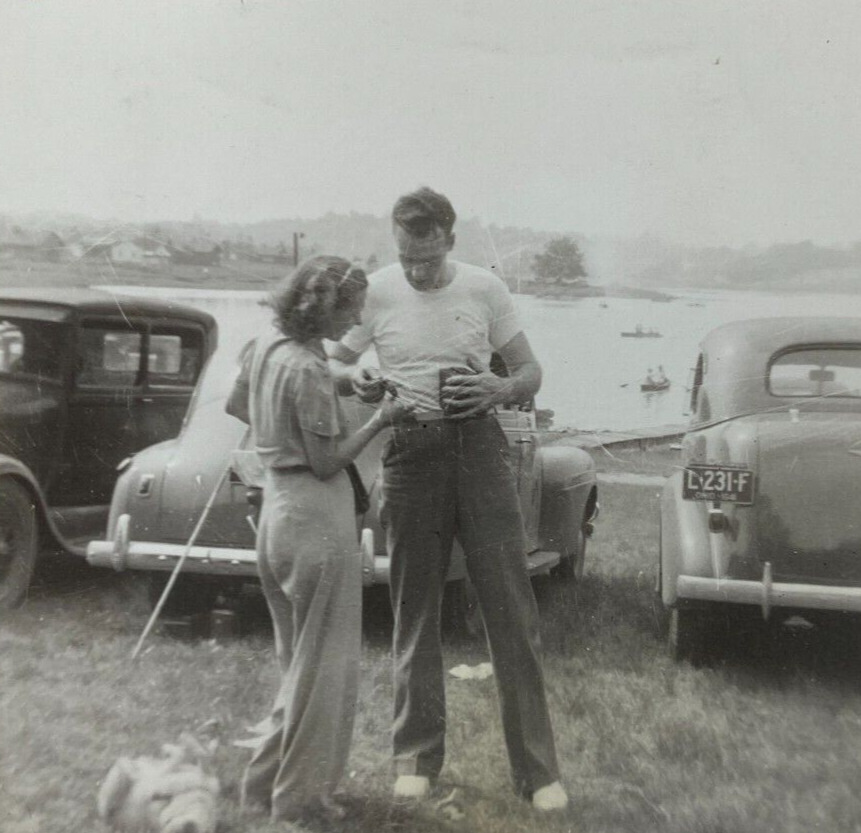 Man & Woman Looking At Hands By Cars In Ohio B&W Photograph 3.5 x 3.5