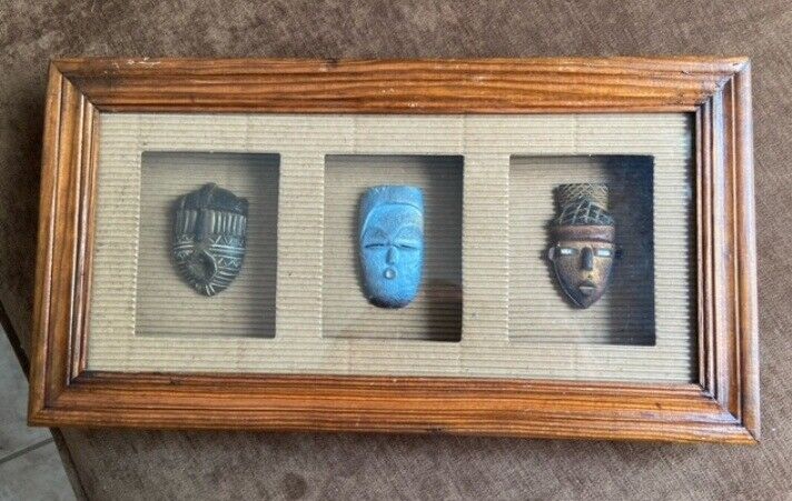 Framed artifacts, 15” x 8”/ two masks and one shield. Very Good Condition 