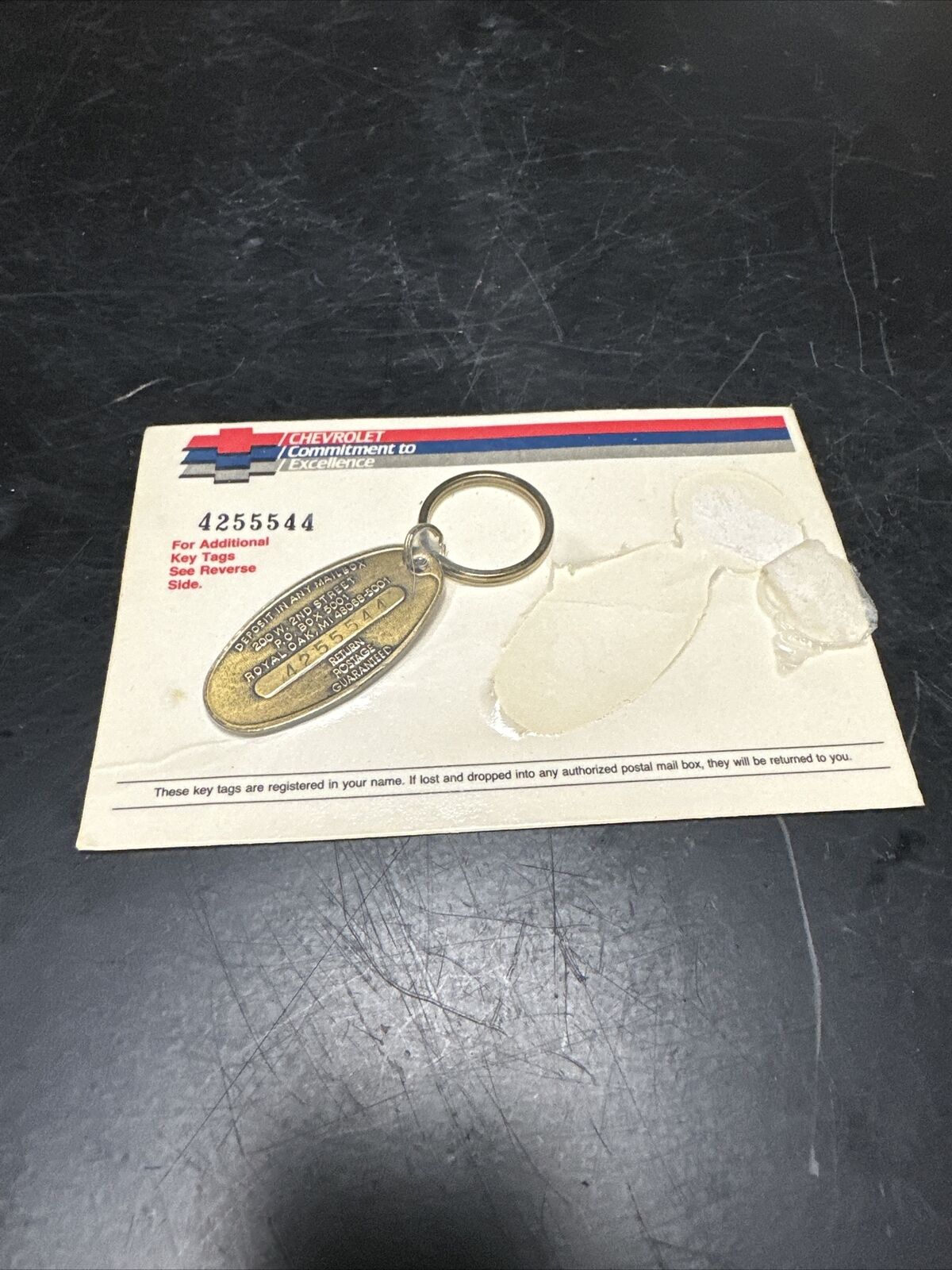 Chevrolet brass key ring tag Commitment to Excellence registered, postage return
