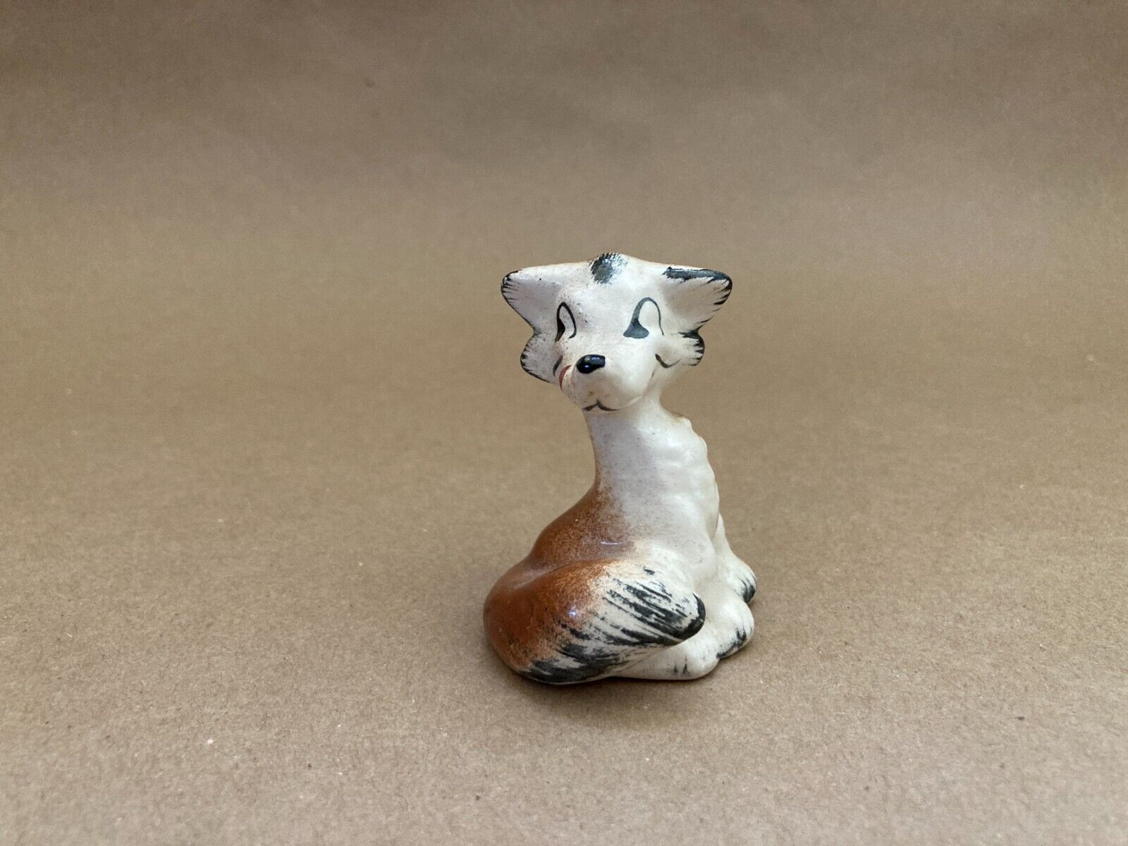 Vintage kitschy smiling mischievous porcelain fox figurine knick knack