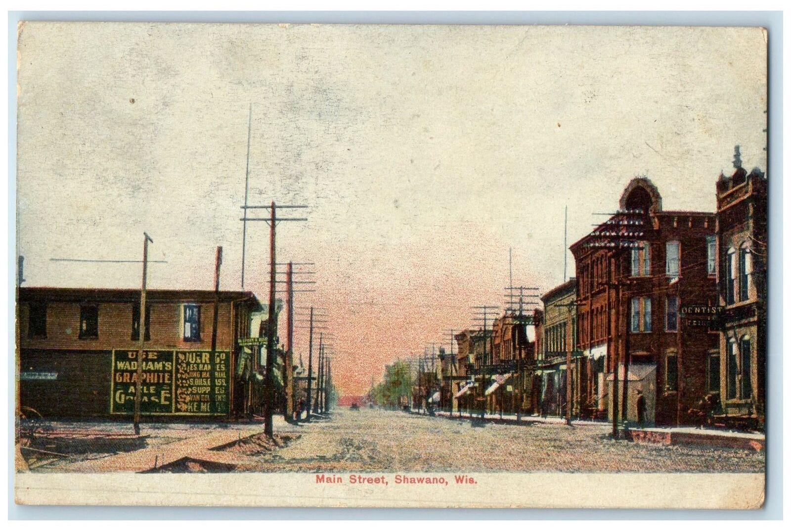 1907 Main Street Dirt Road Buildings Power Lines View Shawano Wisconsin Postcard