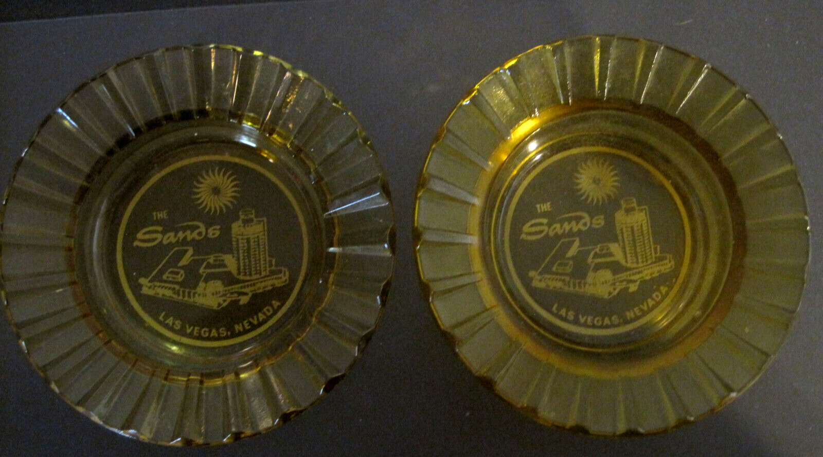 2 VINTAGE AMBER COLORED ASHTRAYS FOR THE SANDS HOTEL AND CASINO  LAS VEGAS