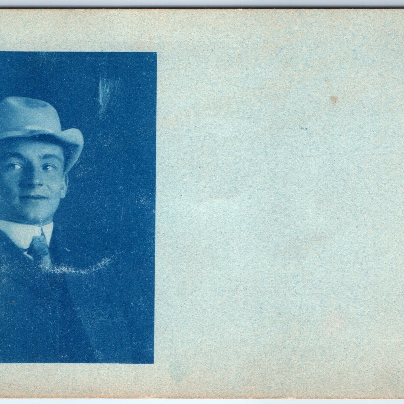 1900s UDB Handsome Young Man CYANOTYPE RPPC Unique Hat Smirk Side Eye Photo A173