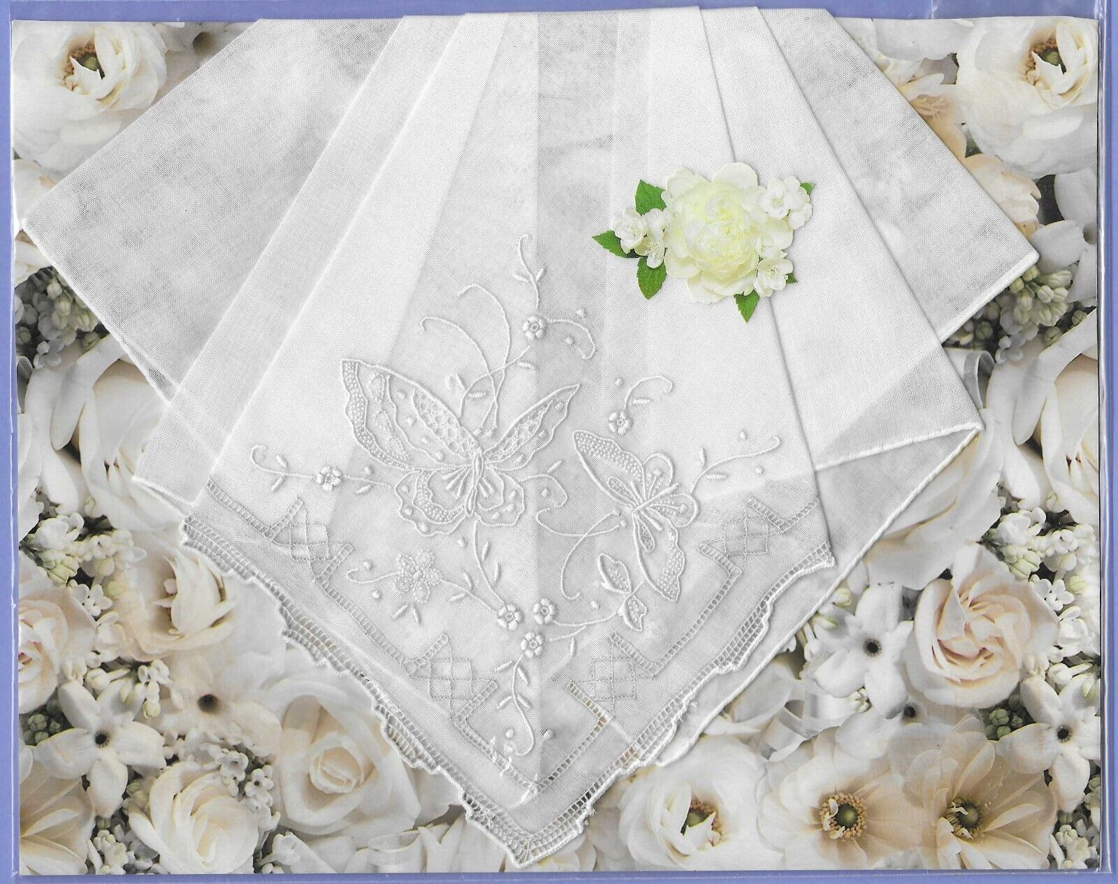 Beautiful vintage white linen handkerchief with butterfly embroidery for display