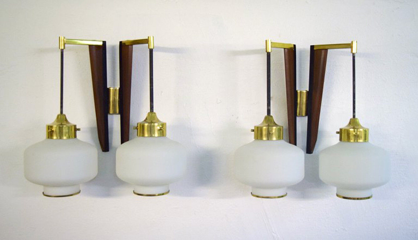 A pair of STILNOVO modernist wall lamps in teak and brass. Opal glass. 1950s