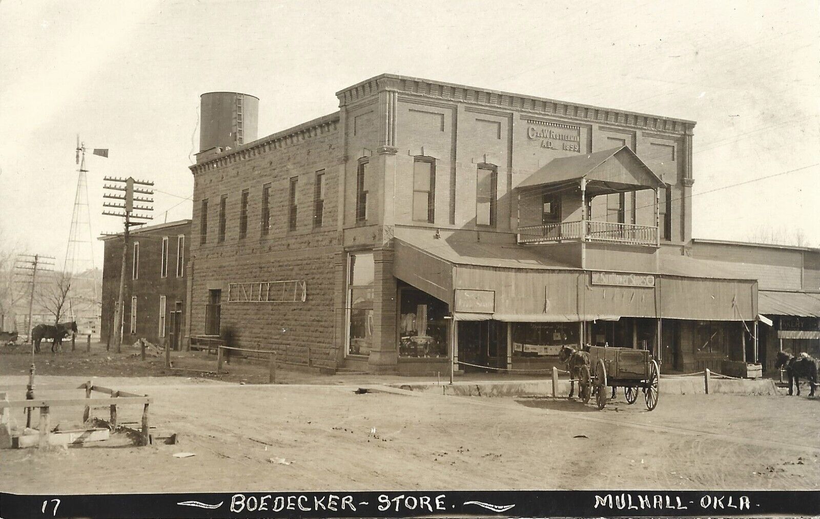 Mulhall OK-Boedecker general store, Sunflower Shoes, dusty road; nice 1910s RPPC
