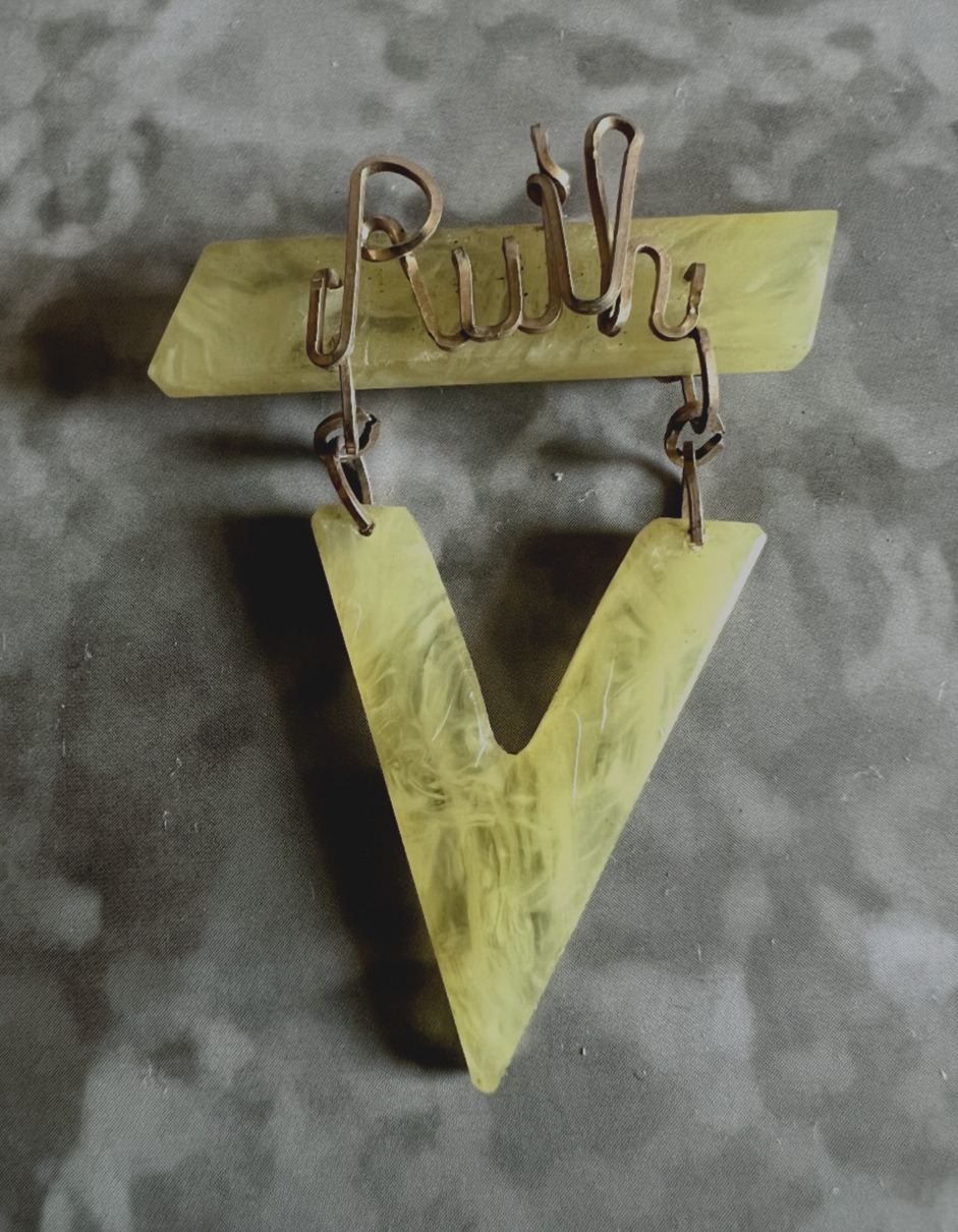 VINTAGE PLASTIC NAME AND V FOR VICTORY PIN