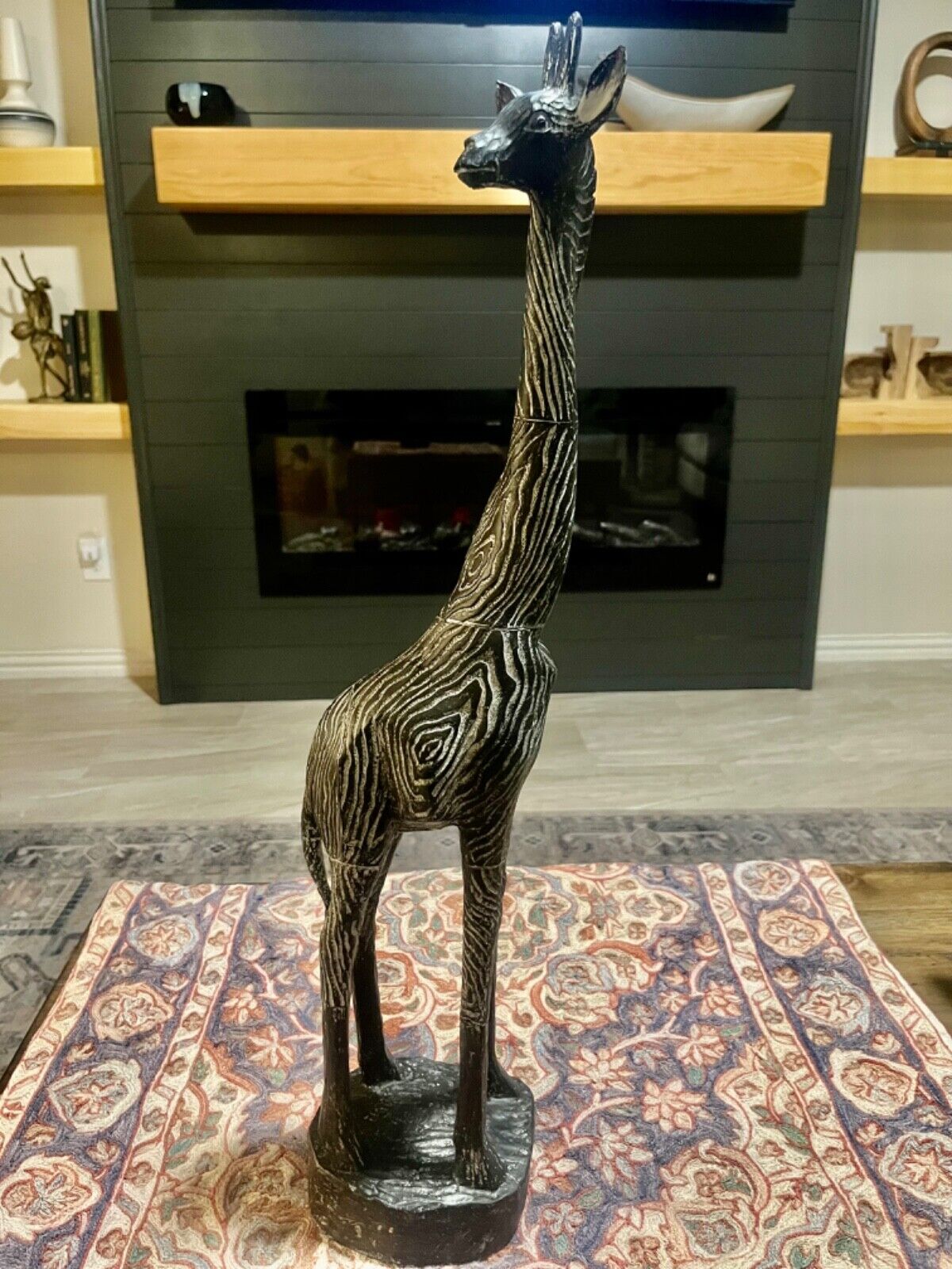 An elegant statuesque resin Giraffe with black& silver textured surface