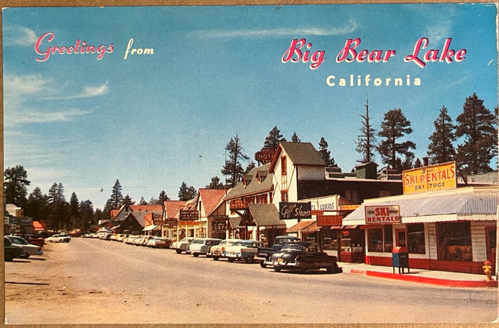 Big Bear Lake California Main Street Ski Rentals Old Cars Vintage Postcard c1950