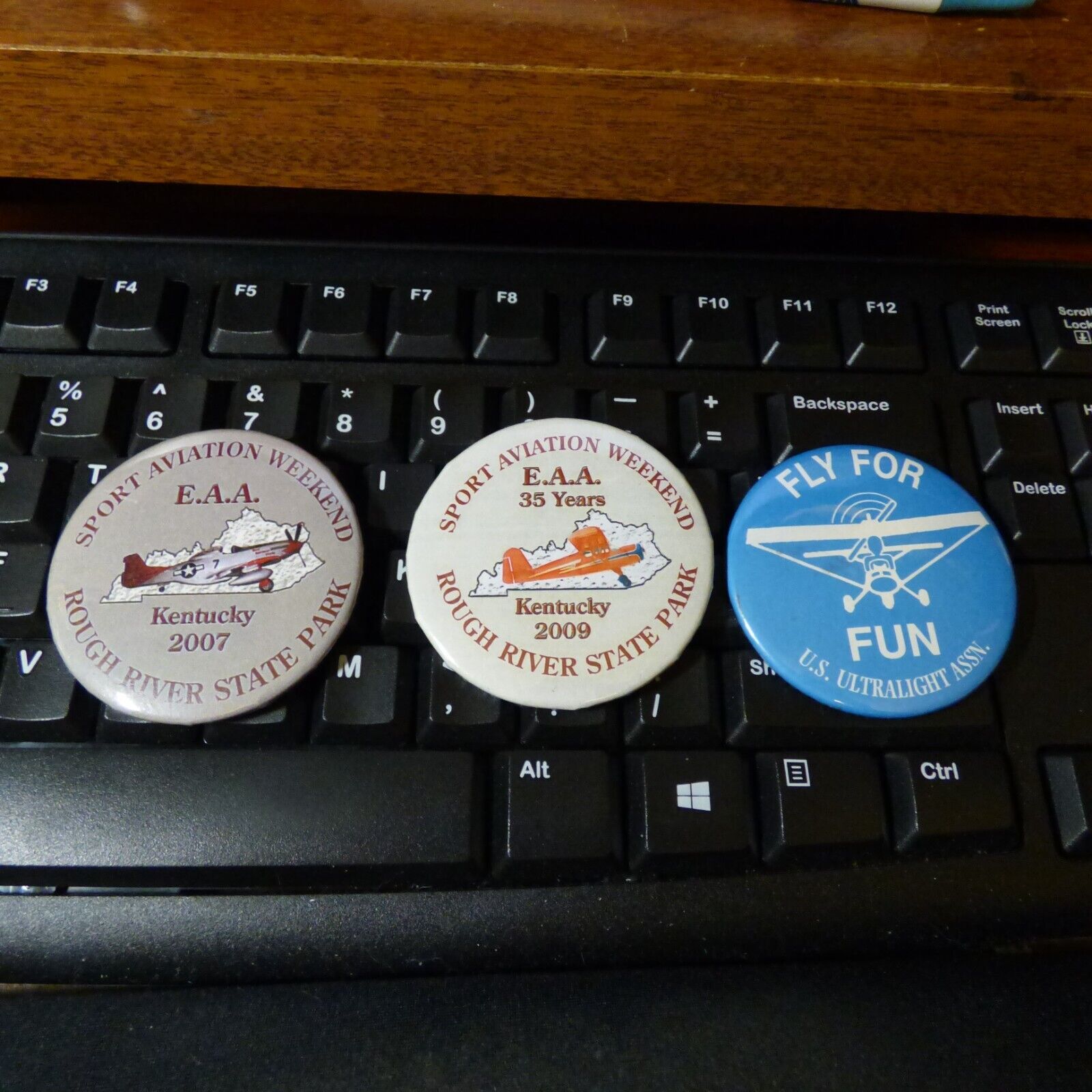Lot of Four EAA Sport Aviation Pinbacks - Mint Condition