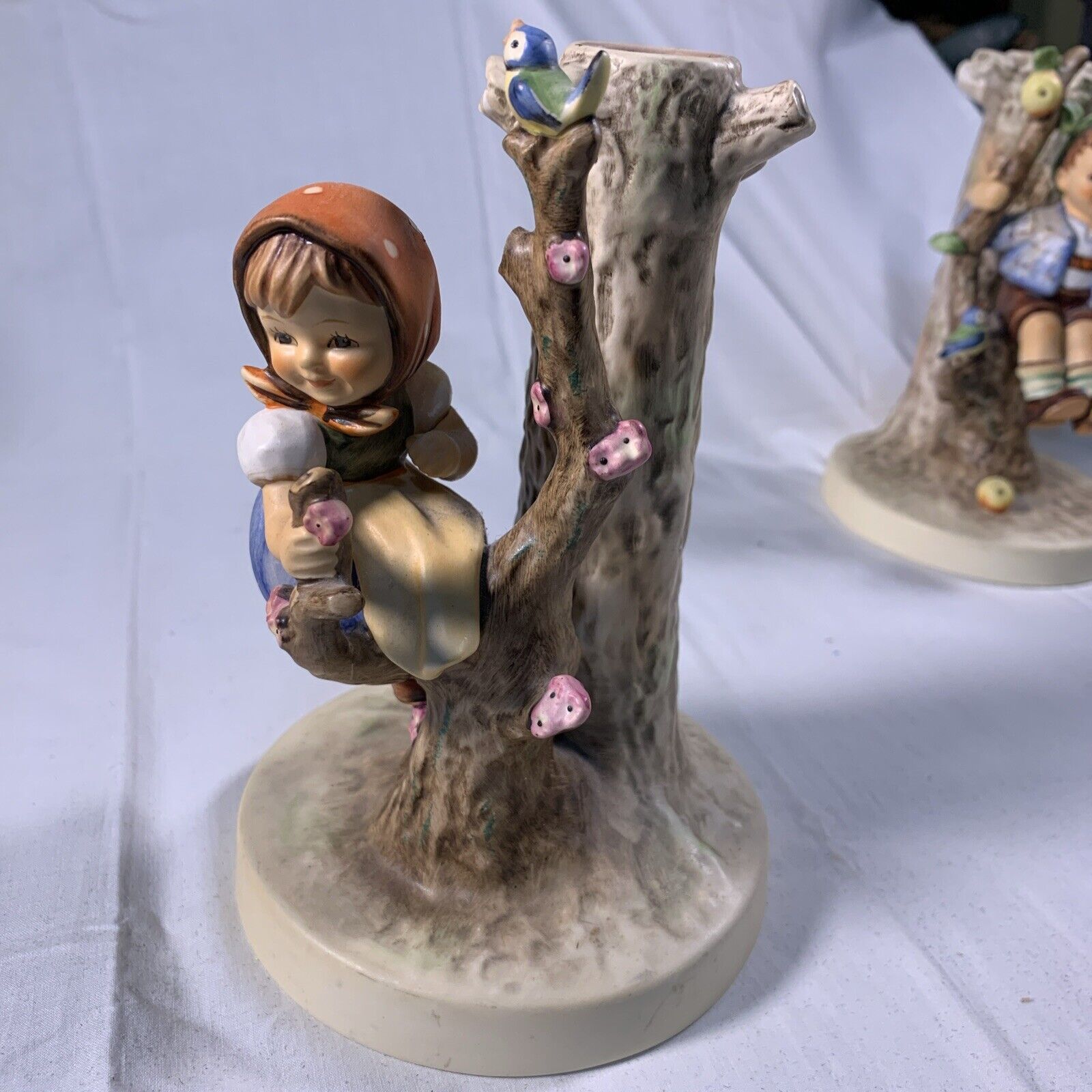 Highly collectible Goebel Hummel “Girl In Tree With Bird”  Figurine 676