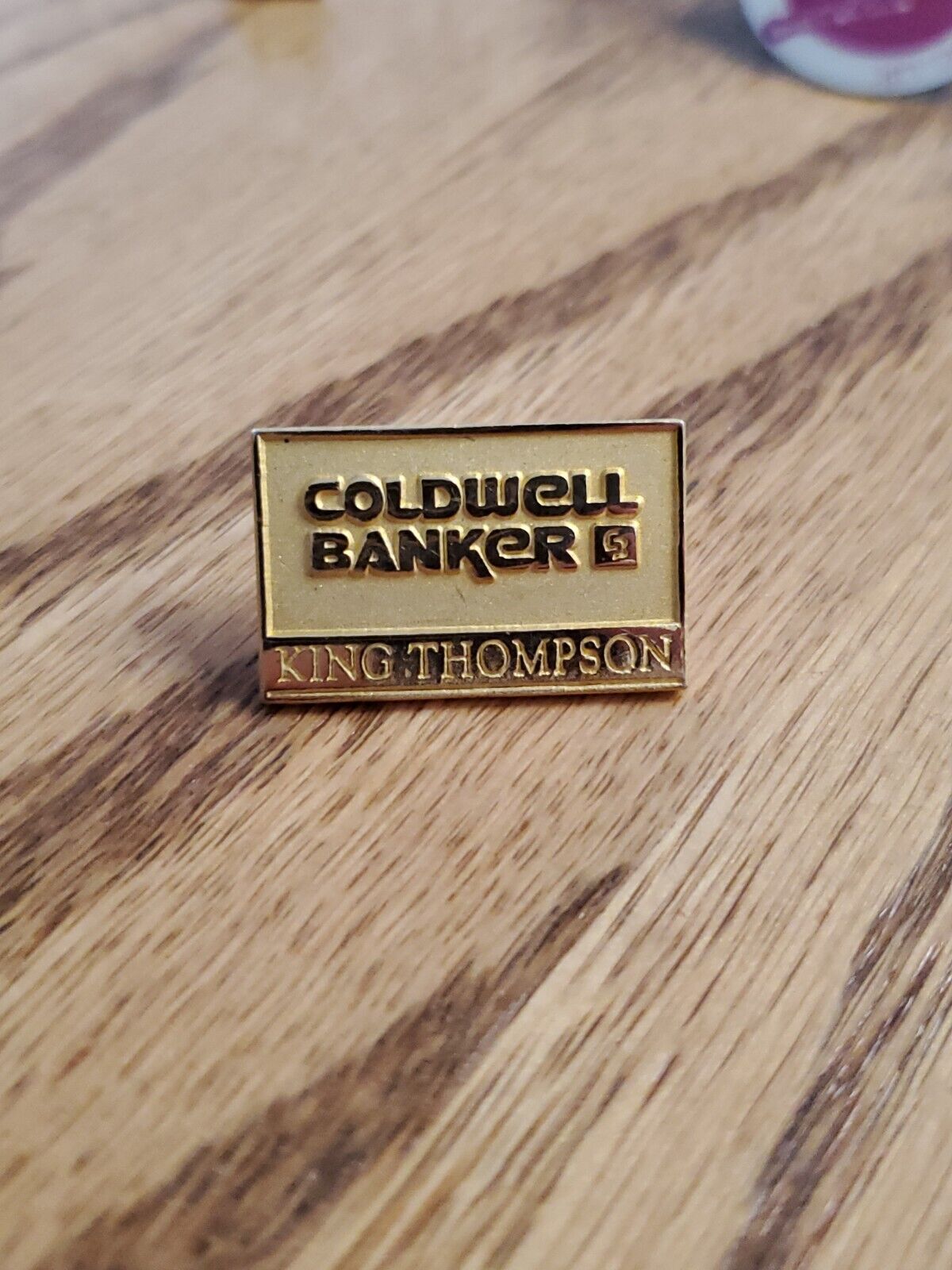 Gold tone Coldwell Banker King Thompson logo badge realtor realty lapel pin qv