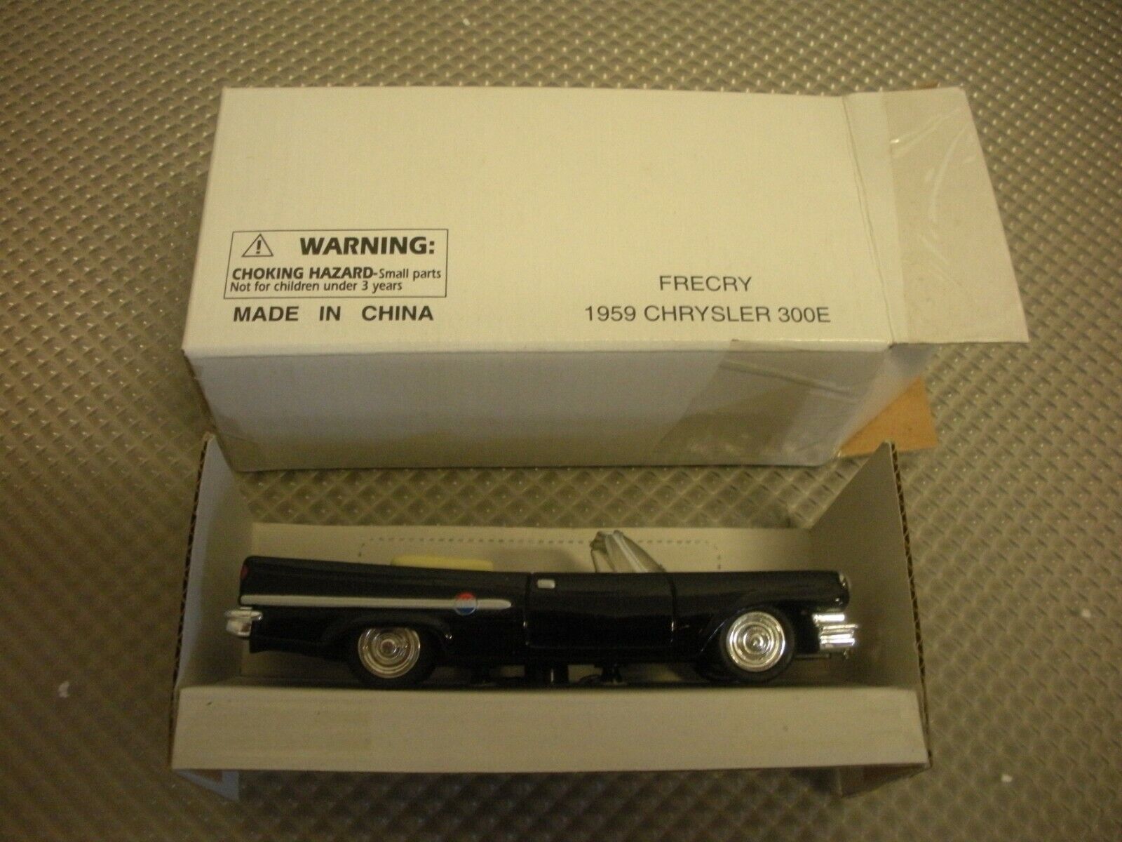 New Ray #FRECRY Die-Cast 1959 Chrysler 300E Convertible. Measures 4.5” long. New