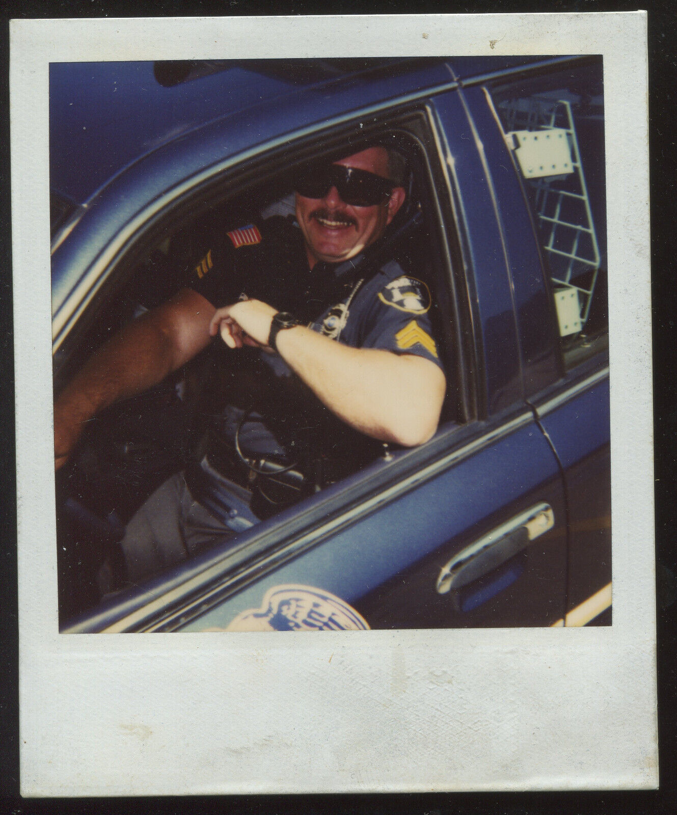 FOUND PHOTO Polaroid Police Officer in Squad Car Cop Color Snapshot VTG