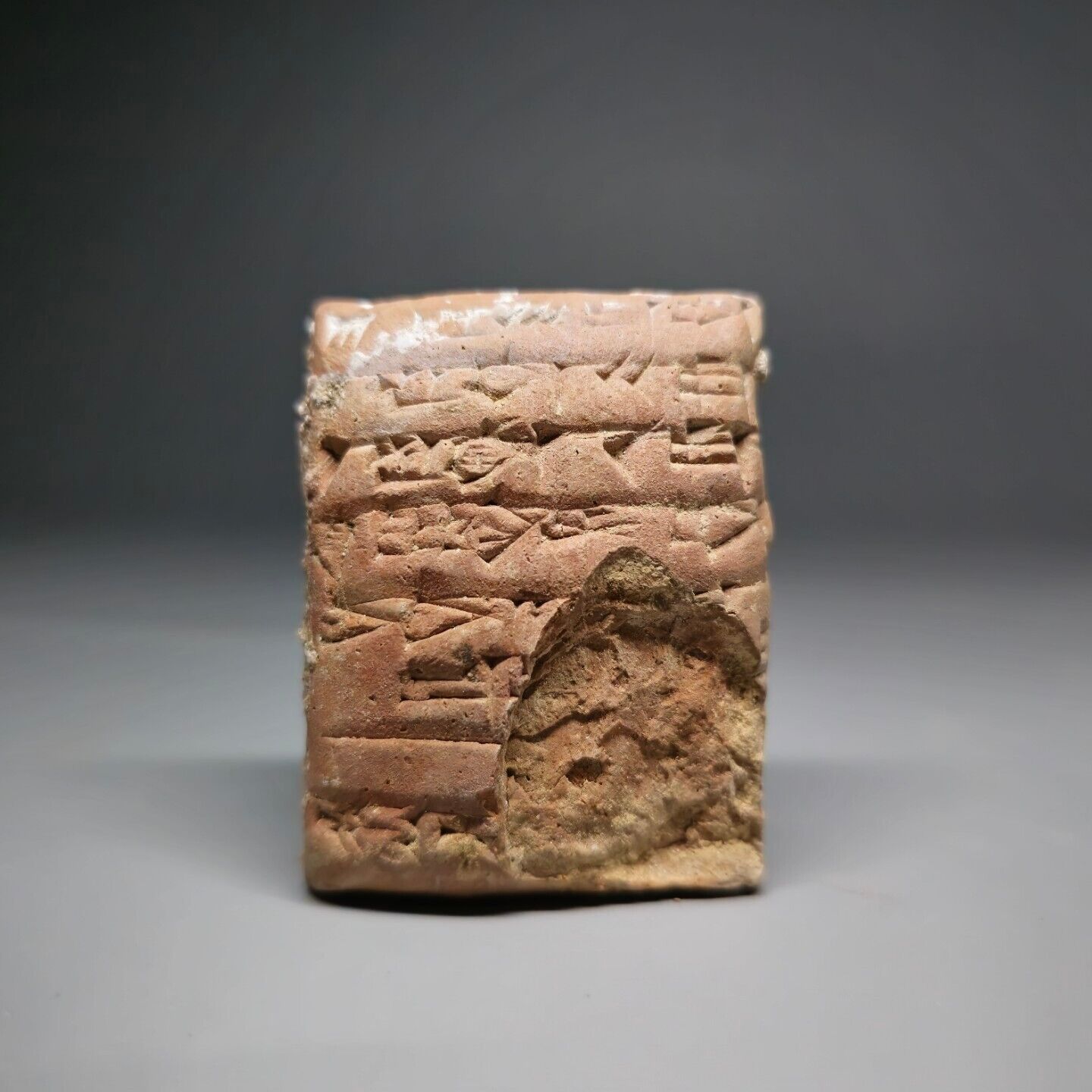 CIRCA NEAR EASTERN CUNEIFORM CLAY TABLET WITH EARLY FORM OF WRITINGS.