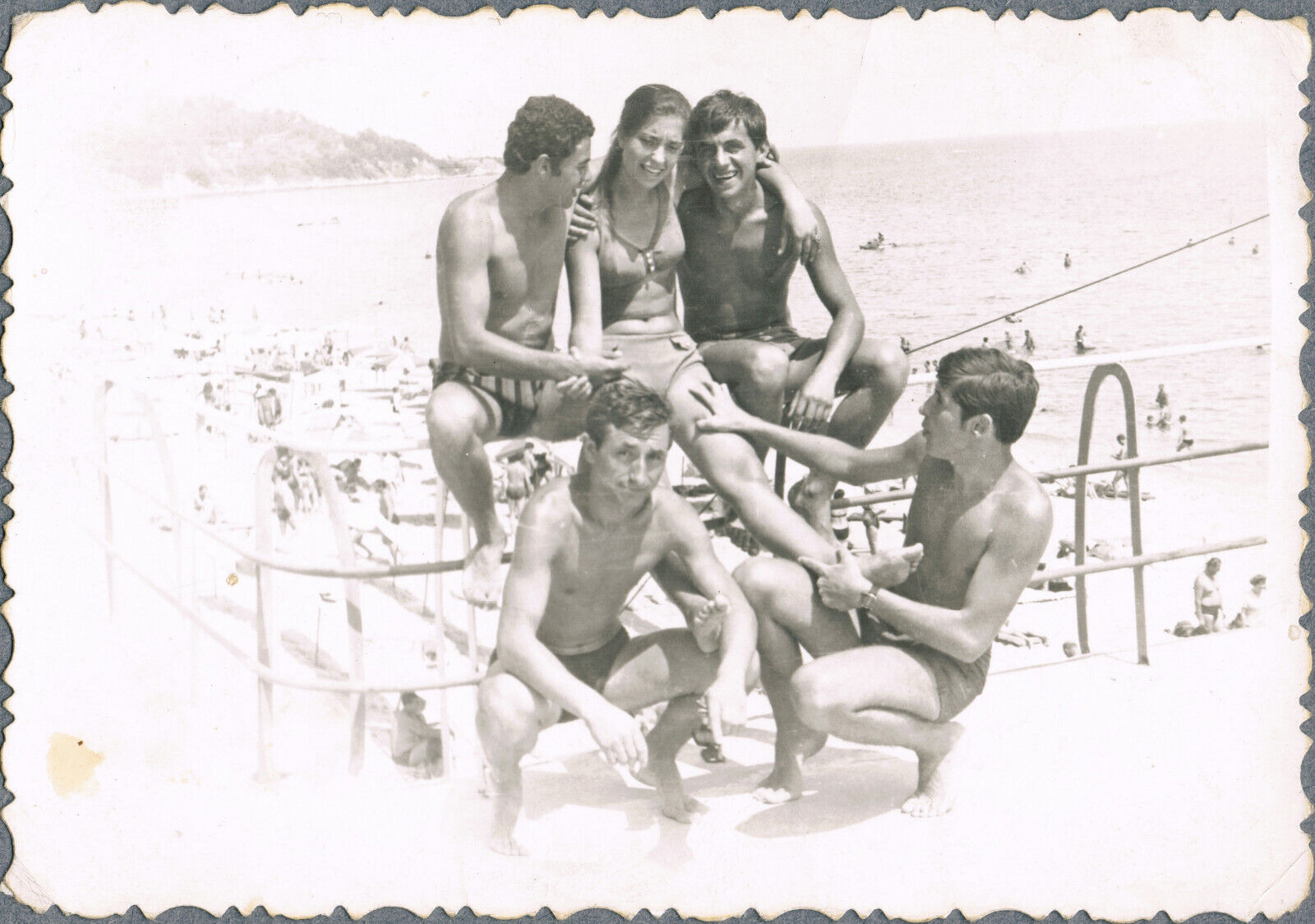 1950s Beautiful boys and girls in bathing suits on the beach Vintage photo