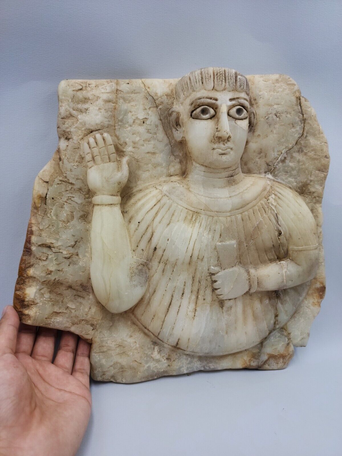 AN IMPORTANT LARGE SOUTH ARABIAN SABEAN ALABASTER STONE STELE WITH A FEMALE BUST