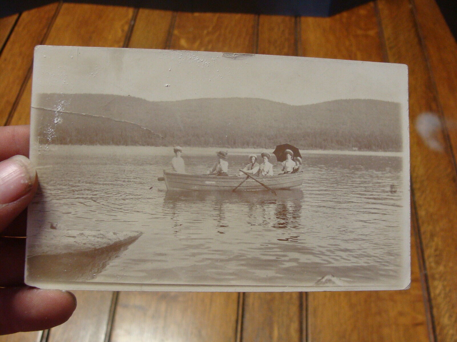 2 vintage REAL PHOTO POSTCARDS people in boat, people on stoop