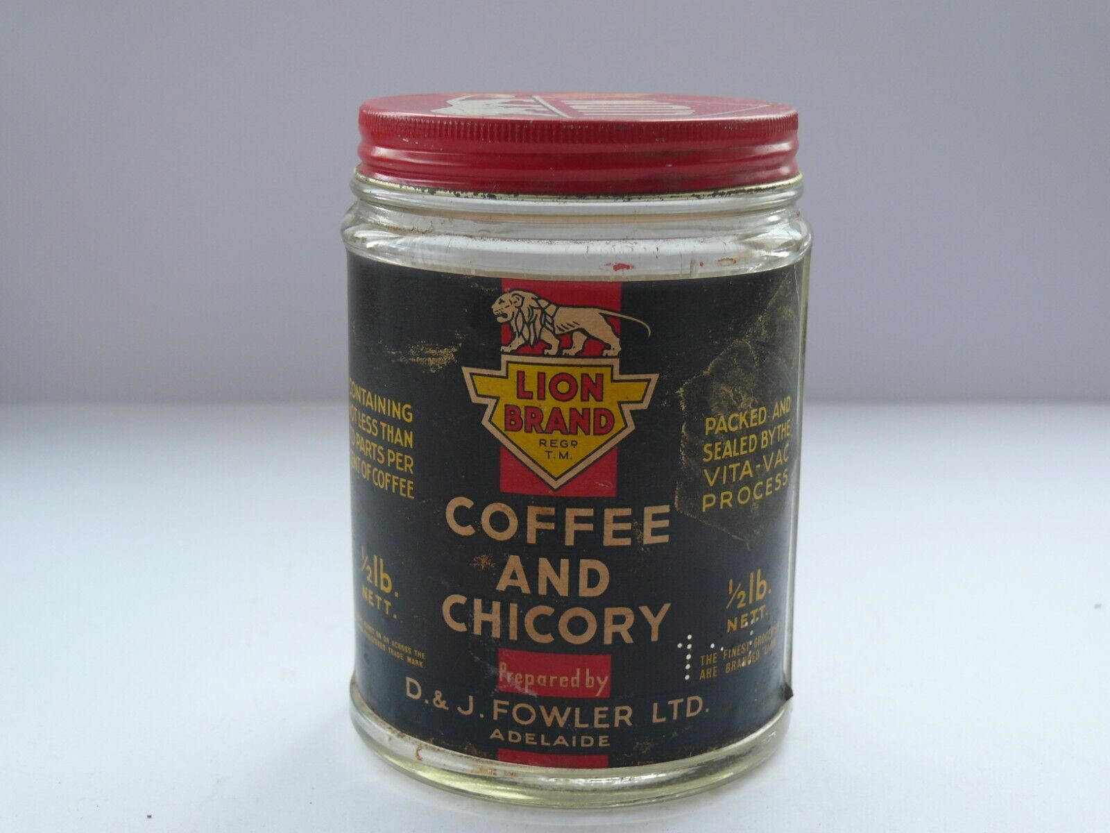 VINTAGE AUSTRALIAN LION BRAND 1/2LB COFFEE AND CHICORY JAR.