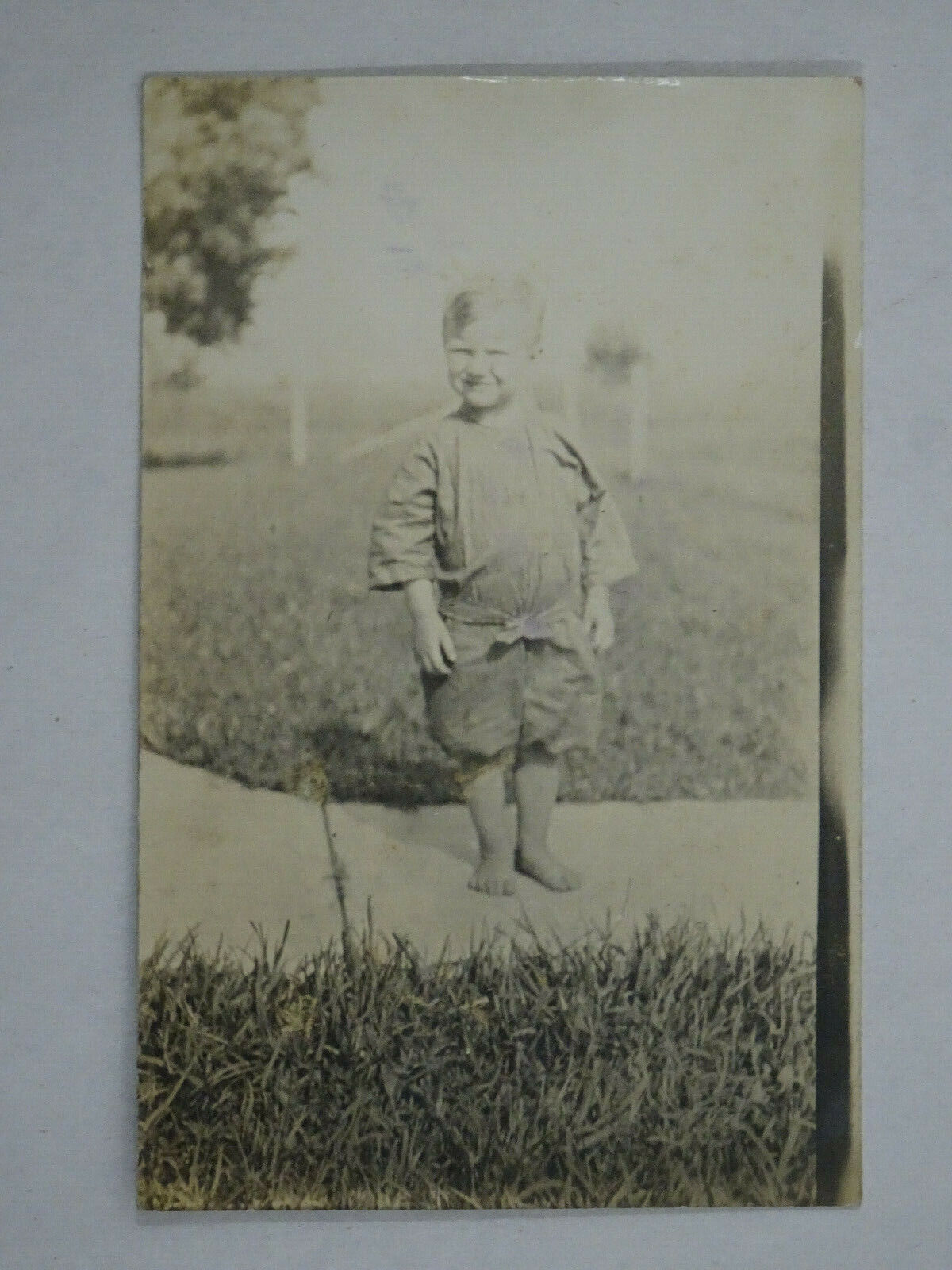 1913  Real Photo Postcard Barefoot Boy On Sidewalk Levi Lewis Palo IA USA