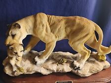 Suanti Galleries Vintage Lioness Carrying Her Cub picture