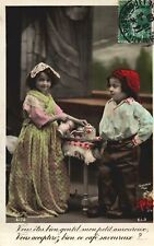 VINTAGE POSTCAR COUPLE OF CHILDREN ENACTING DRINK AT CAFE' RPPC MAILED IN 1909 picture