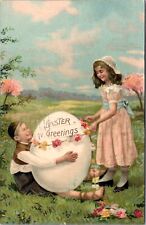 Easter Postcard Girl Placing Flowers Around Giant Egg That Boy is Holding picture