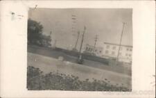 1913 RPPC Bucyrus,OH Man other side of wall on roadway,buildings Ohio Postcard picture