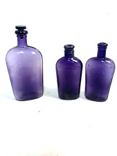 Vintage Purple Glass Whiskey Bottles, embossed, Dug bottles, set of 3 picture