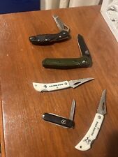 lot of pocket knifes picture