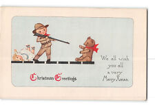 Christmas Greetings Postcard 1919 Boy Pointing Gun at Teddy Bear picture